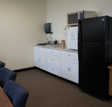 A kitchenette in a conference room.