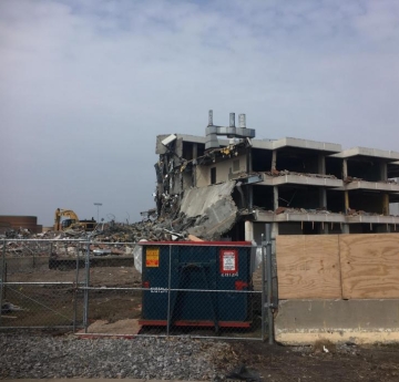 A construction site with a partly demolished building.