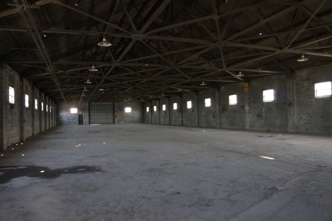 the interior of a large, empty garage building