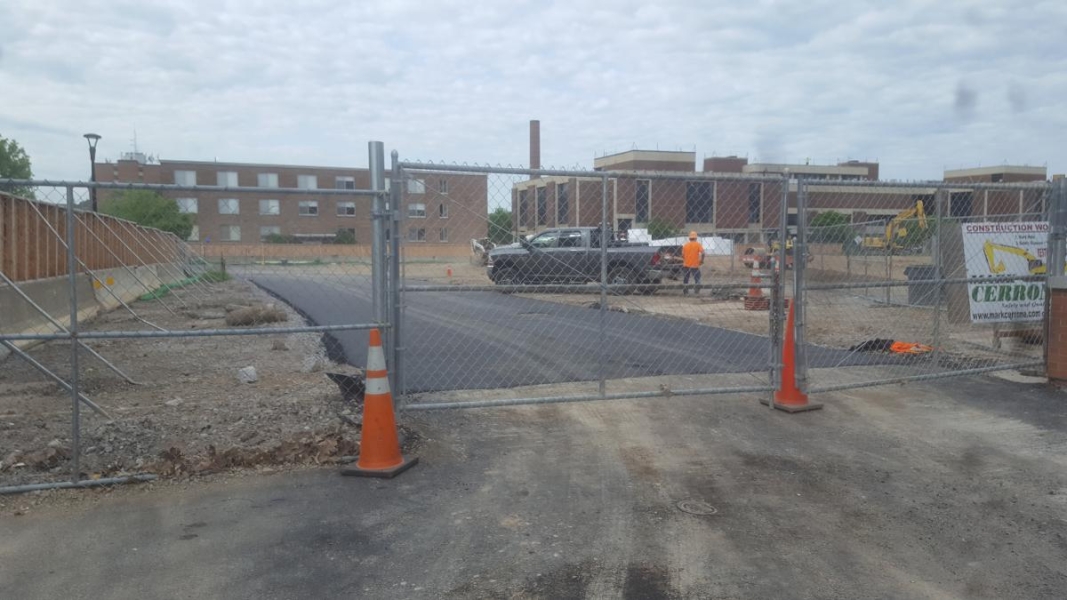 A freshly paved road in a construction site.