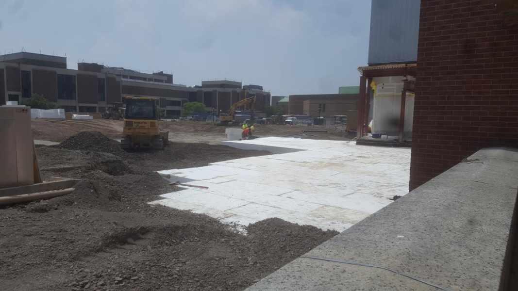 White foam blocks fill a hole in the ground of a construction site.