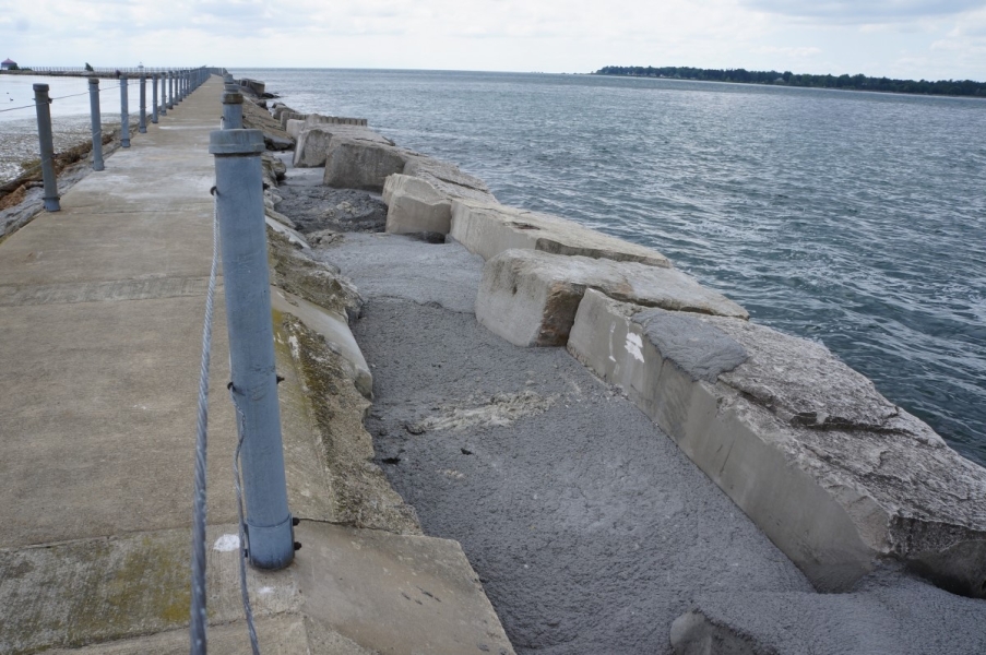 Blocks and concrete along a pier walkway in the river