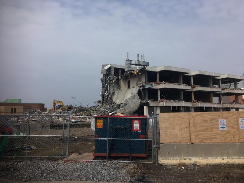 A construction site with a partly demolished building.